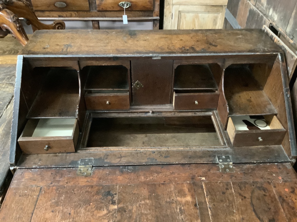 A mid 18th century oak bureau, width 88cm, depth 50cm, height 105cm